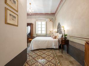 Postel nebo postele na pokoji v ubytování PALAZZO CHERCHI