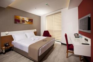 Postel nebo postele na pokoji v ubytování Buca Residence Hotel