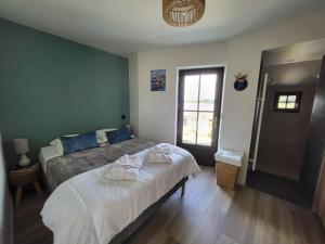 Postel nebo postele na pokoji v ubytování Ker Tal