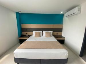 En eller flere senger på et rom på Hotel Plaza Real Ocaña
