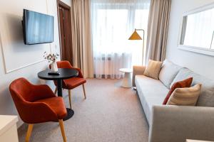 Χώρος καθιστικού στο Ośrodek Szkoleniowo Wypoczynkowy Galicya