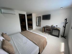 En eller flere senger på et rom på Hotel Plaza Real Ocaña