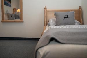 Postel nebo postele na pokoji v ubytování Hotel Gasthof Alter Wirt