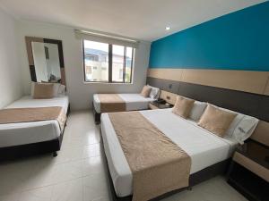 En eller flere senger på et rom på Hotel Plaza Real Ocaña