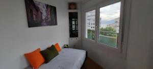 En eller flere senge i et værelse på Charming Apartment in Vigo - 45 m² - Garden View