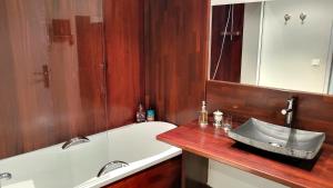 a bathroom with a sink and a bath tub at Villa Le Loft by Festif Azur 4-Star 200m2 House with Garden, 5-Min Walk to Palais des Festivals and Beaches in Cannes +65 photos