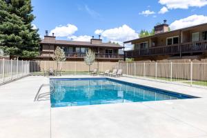 a swimming pool in front of a house at Val D Sol Retreat at Perfect Sun Valley Base in Sun Valley