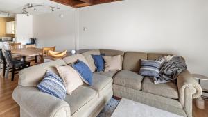 a living room with a couch with pillows on it at Bolton Condo condo in Bolton