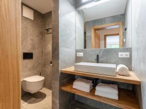 Koupelna v ubytování Appartement Schmittenblick Top 1 + 27 fotografií