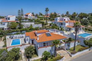 an aerial view of a house with an orange roof at Villa Ricardo by Villa Plus in Carvoeiro