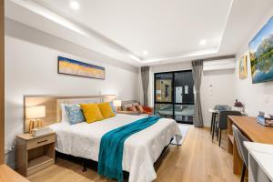 a bedroom with a bed and a dining room at Starlet 11 in Lake Tekapo