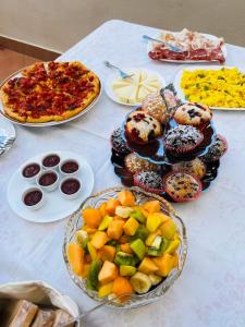 a table with different types of food on it at Casa castello in Rocca Imperiale +31 photos