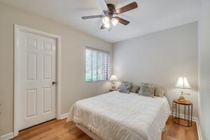 a bedroom with a bed and a ceiling fan at Lakefront Crossville Condo - Fish, Boat and Golf! in Fairfield Glade +27 photos