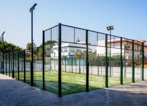 a batting cage with lights on top of it at Apartamento Playa de Punta Candor in Rota