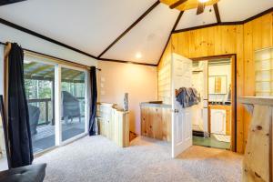 a room with a sliding glass door and a kitchen at Unique West Jefferson Home with Fire Pit and Grill! in West Jefferson