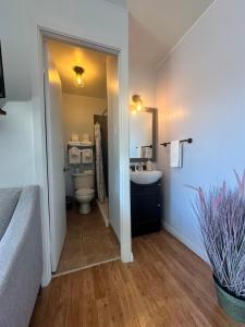 a bathroom with a toilet and a sink at Motel de L'Anse et Camping Rimouski in Rimouski +72 photos