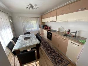 a kitchen with a table and a counter top at Transilvania rent in Hunedoara