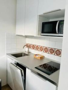 Kuchyň nebo kuchyňský kout v ubytování City flat 8 + 11 fotografií
