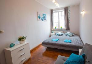 Postel nebo postele na pokoji v ubytování BaySide Apartments MainCity