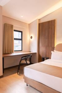 Postel nebo postele na pokoji v ubytování Hotel Lincoln