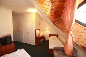 Posteľ alebo postele v izbe v ubytovaní Hotel Főnix