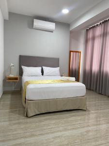 Postel nebo postele na pokoji v ubytování Bendezu Hotel