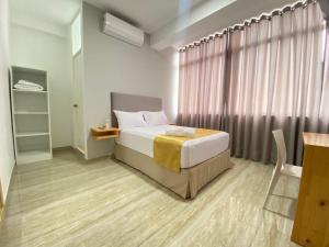 Postel nebo postele na pokoji v ubytování Bendezu Hotel