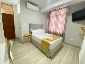 Postel nebo postele na pokoji v ubytování Bendezu Hotel