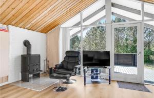 Μια τηλεόραση ή/και κέντρο ψυχαγωγίας στο Holiday Home Gl Hovej X