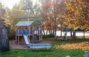 a playground in a park with a slide and a cross at 2 Bedroom Gorgeous Home In Verchen in Verchen +31 photos