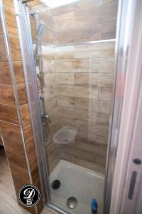 a bathroom with a shower with a sink at Domo San Leone Uta in Uta +87 photos