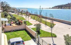 a car parked in a parking lot next to the water at Casa Manuela in Marinella di Sarzana