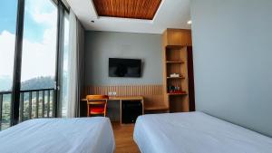Damar Langit Resort房間的床