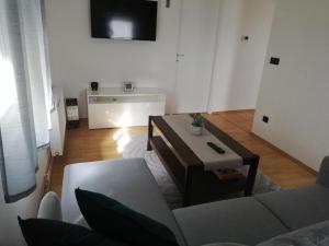 a living room with a couch and a table at Kuća za odmor Bartol in Popovača