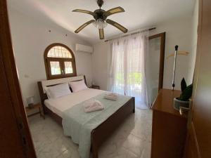 Postel nebo postele na pokoji v ubytování Yota's House