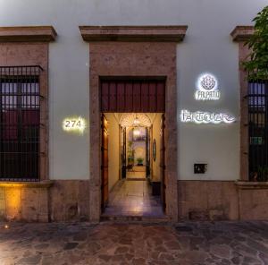an entrance to a building with the door open at Palpatio Hotel Boutique in Guadalajara
