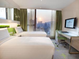 Cama o camas de una habitación en Dorsett Tsuen Wan, Hong Kong