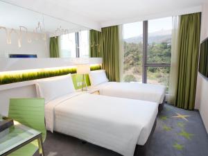 Cama o camas de una habitación en Dorsett Tsuen Wan, Hong Kong