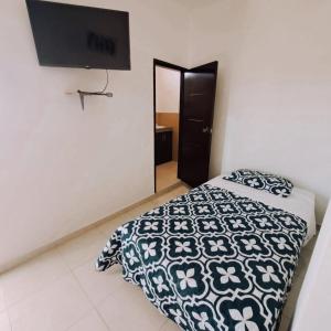 Postel nebo postele na pokoji v ubytování Hosteria La Veleta, Playas