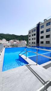 a large swimming pool on top of a building at Montesun RAF Apartments in Budva