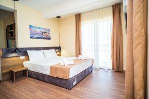 Postel nebo postele na pokoji v ubytování Villa Irina