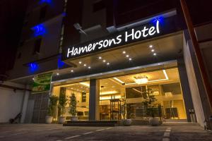 a store front of a hamsons hotel at night at Hamersons Hotel in Cebu City