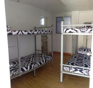 Postel nebo postele na pokoji v ubytování Mang Ben Dormitory