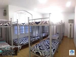 Postel nebo postele na pokoji v ubytování Mang Ben Dormitory