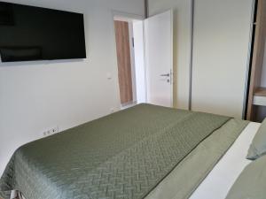 Postel nebo postele na pokoji v ubytování Apartman Metković City