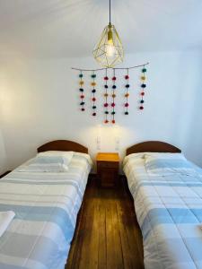 Postel nebo postele na pokoji v ubytování Flying Dog Hostel Cusco