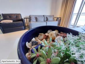 Khu vực ghế ngồi tại Book Santos - Unlimited - Apartamentos Vista Mar em condomínio de Luxo