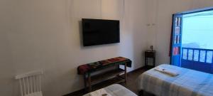Postel nebo postele na pokoji v ubytování Flying Dog Hostel Cusco