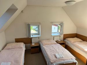 Postel nebo postele na pokoji v ubytování Apartmán 3 Ohradské náměstí - ČASPV