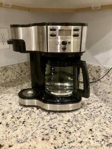 a coffee maker sitting on top of a counter at Brand New, Peaceful, and Dogs Stay Free in Marion Oaks